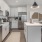 a kitchen with white cabinets