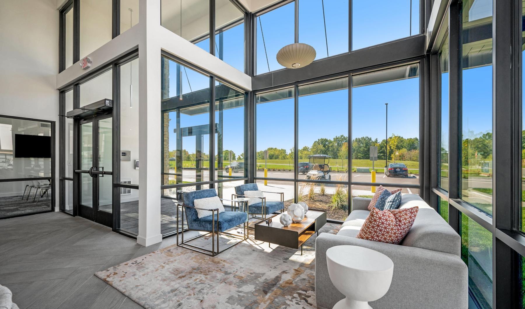 Everything within reach a room with a patio and chairs