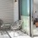 a room with a table chairs and a glass door