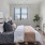 a bedroom with a bed and a tv