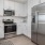 a kitchen with white cabinets