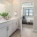 a bathroom with a bed and a mirror