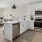 a kitchen with white cabinets