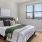 a bedroom with a bed and a fan