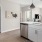 a kitchen with white cabinets