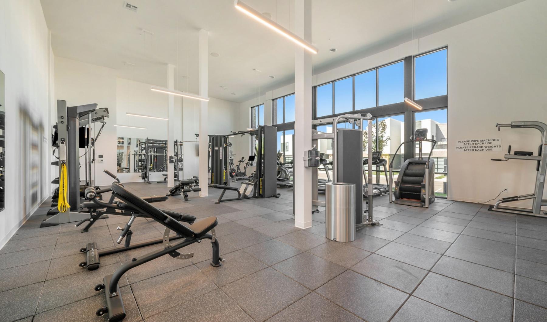 State-of-the-art amenities a gym with exercise equipment