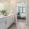 a bathroom with a bed and a mirror