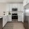 a kitchen with white cabinets
