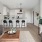 a living room with a table and chairs