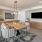 a living room with a table and chairs