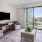 a living room with a tv and couches