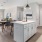 a kitchen with a dining table and chairs